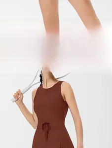 Detail of coffee brown backless tennis dress showing side slit and adjustable drawstring