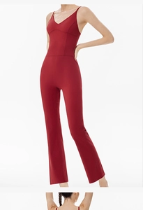 Deep red backless yoga jumpsuit with flare leg design and slim fit athletic silhouette
