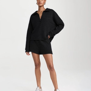 Detail view of black casual two-piece set featuring V-neck long sleeve top and drawstring shorts