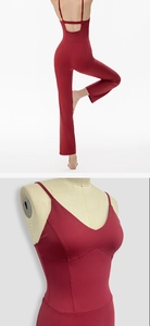 Detail of burgundy backless yoga jumpsuit with thin straps and breathable cut-out design