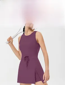 Detail of purple backless tennis dress showing side slit and built-in shorts