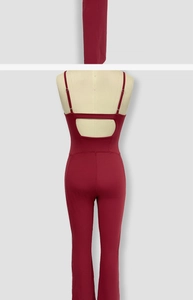 Detail view of burgundy backless yoga bodysuit with cut-out design and thin straps