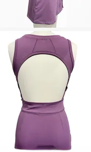 Detail view of the open-back design and moisture-wicking fabric of this purple tennis dress