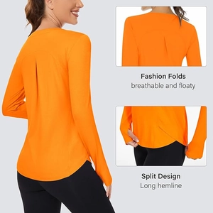 Detail view of orange yoga shirt showing fashion folds and a split hemline design