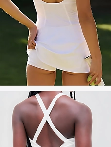 Detail of white tennis dress showing built-in shorts and criss-cross back straps design