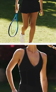 Detail of a black V-neck tennis dress showing stretch fabric and built-in bra padding