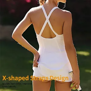 White V-neck tennis dress with X-cross back straps and built-in shorts for outdoor sports