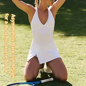 White V-neck athletic tennis dress with asymmetrical pleated skirt and shorts