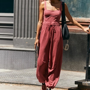 Detail of vintage pink sports set featuring high-waisted joggers and square neck tank top