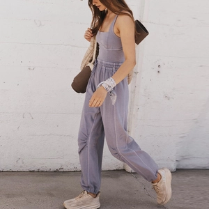 Detail view of lilac fitness set featuring a square neck tank top and pleated joggers