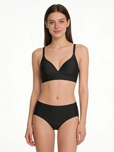 Detail view of black seamless wireless bra and briefs set with smooth fabric texture