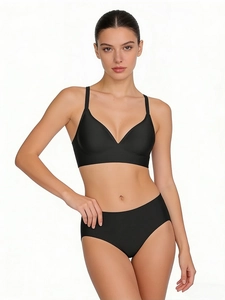 Close-up of black seamless V-neck bra and high-waist panty set with elastic fabric