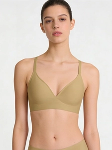 Detail of olive green seamless wireless bra with thin straps and deep V-neckline