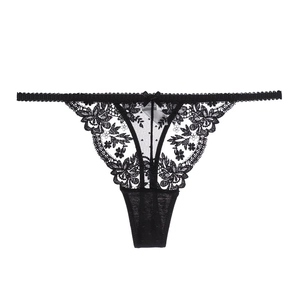 Detailed view of black lace thong with floral pattern and a silk bow decoration