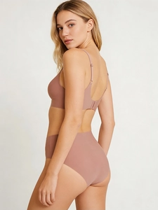 Rear view of seamless wireless bra set in dusty rose with high waist panty on model