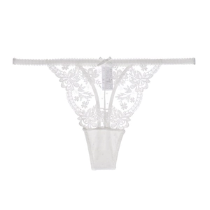 Detailed view of white floral lace T-back thong with a small center bow and washing label