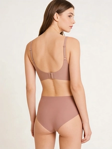 Detail view of seamless dusty pink bra set with adjustable straps and soft stretch fabric