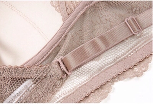 Detail of adjustable straps and lace texture on a French U-shaped low back bra