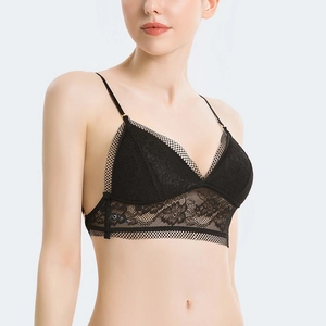 Detail of black lace triangle bralette with floral patterns and adjustable straps