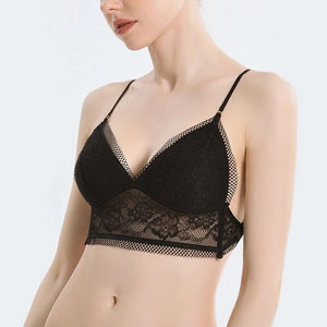Close-up of black floral lace bralette with adjustable straps and wide hem detail