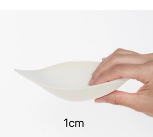 Detail of 1cm thin breathable white sponge bra padding showing softness and thickness