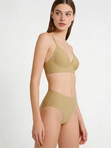 Seamless light brown wire-free bra and high-waisted briefs set on a model