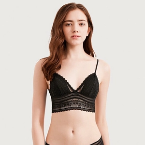 Front view detail of delicate black floral lace texture on French wireless triangle bra