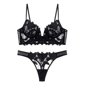 Detailed view of black floral lace lingerie set with sheer mesh fabric and embroidery