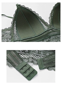 Detail of dark green lace bra showing the double hook-and-eye closure and cup texture