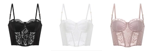 Three lace corset tops in black, white, and pink featuring boning and adjustable straps