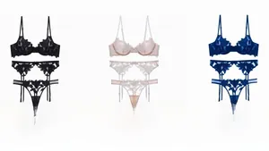 Detailed embroidery lace lingerie set featuring bra, garter belt, and matching panty