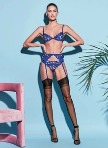 Detail of dark blue lace embroidery lingerie set with mesh fabric and floral patterns