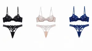 Detailed flat lay of lace floral embroidery lingerie sets in black, beige, and navy colors