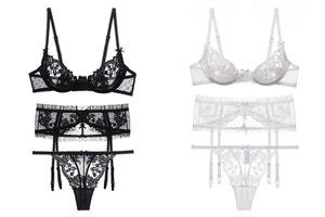 Detail view of French lace embroidery lingerie set with garter belt in black and white