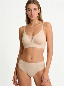 Detail view of seamless nude lingerie set featuring breathable V-neck mesh and soft fabric