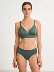 Detail of dark green seamless lingerie set with sheer mesh V-neckline and smooth fabric