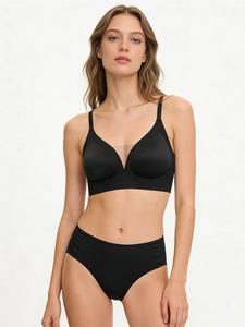 Detail view of black seamless V-neck bra with mesh insert and high waist panty set