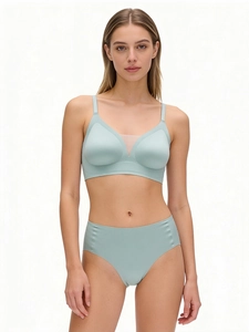 Detail of mint green seamless V-neck bra with mesh stitching and high waist panties