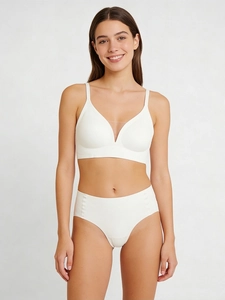Detail of white seamless V-neck lingerie set with sheer mesh panels and high waist fit