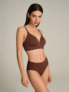 Detail of seamless brown V-neck lingerie set with smooth breathable fabric on model