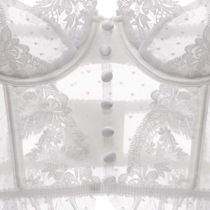 Gros plan d'un corset en dentelle blanche avec boutons en satin et détails en tulle