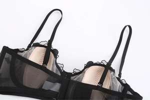 Detail of French floral lace bra with soft padding and delicate mesh embroidery