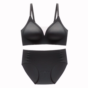 Detail of seamless black mesh V-neck bra set with adjustable straps and smooth fabric