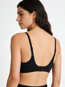 Detailed back view of seamless black bra with U-shaped design and adjustable straps