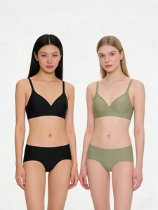 Seamless jelly bra and panty set in black and olive green on models in studio
