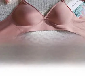 Detail of seamless dusty rose wireless bra with smooth fabric and soft support