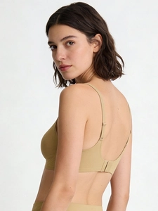 Detail view of seamless U-back bra with adjustable straps and hook-and-eye closure