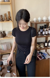 Close-up of a slim-fit black round neck T-shirt with high elasticity soft fabric
