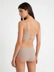Seamless beige jelly bra set with high-waisted panties shown from a side-back view