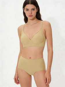 Detail of a seamless beige jelly bra set with high-waist panties and soft fabric texture